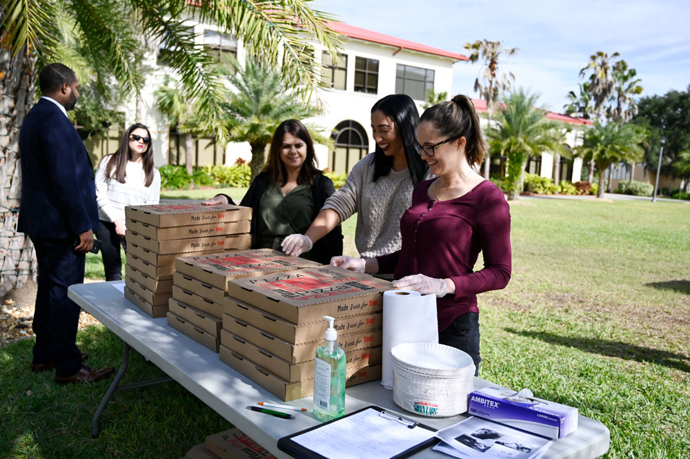 Serving pizza